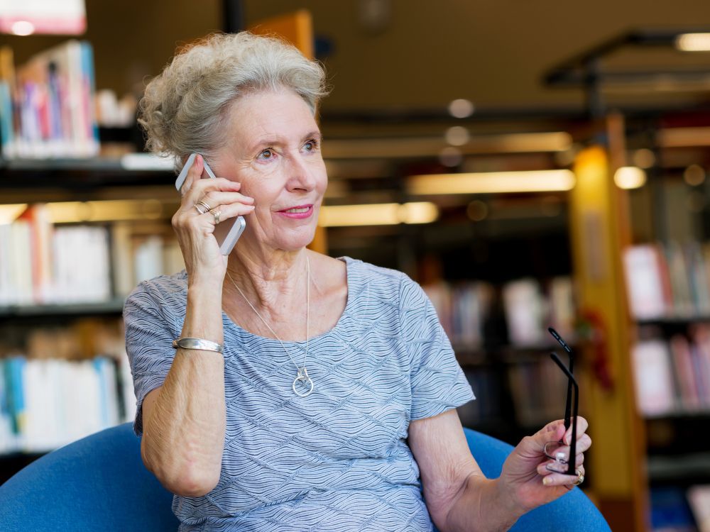 woman talking on phone to vote